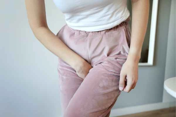 woman running for the toilet because of urinary incontinence Isle of Dogs